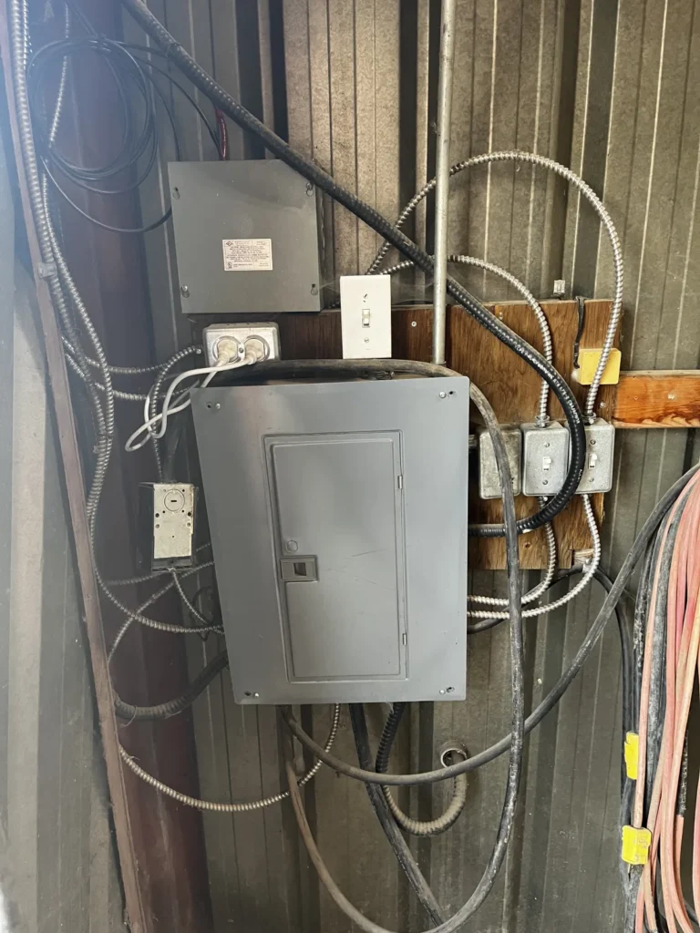 Traditional electrical installation with multiple enclosures and conduit runs