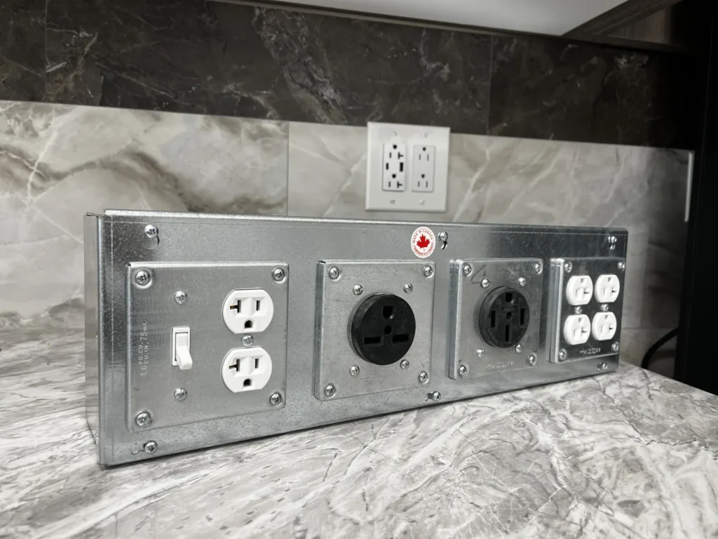 Completed TRU-BOX enclosure with mixed switches, receptacles, and specialty devices